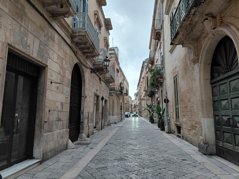 Narrow cobblestone street within the historic center of Lecce